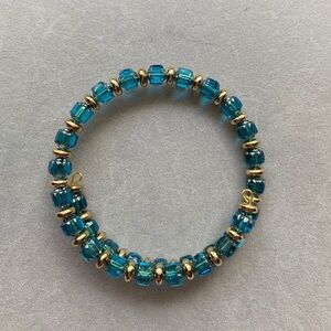 NWOT blue and gold beaded wire bracelet.